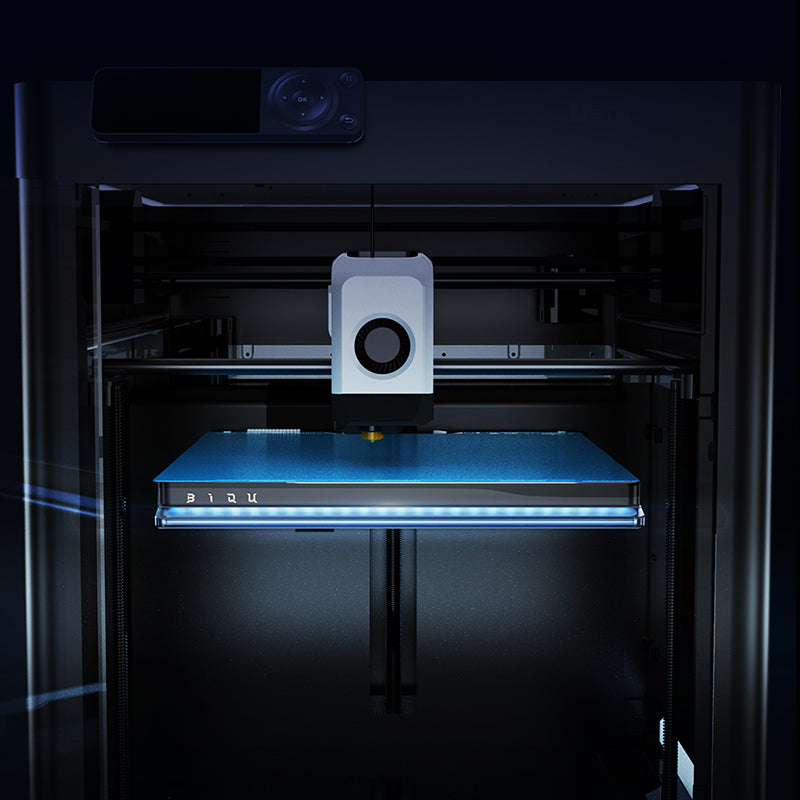 3D printer with a blue platform in a dark setting