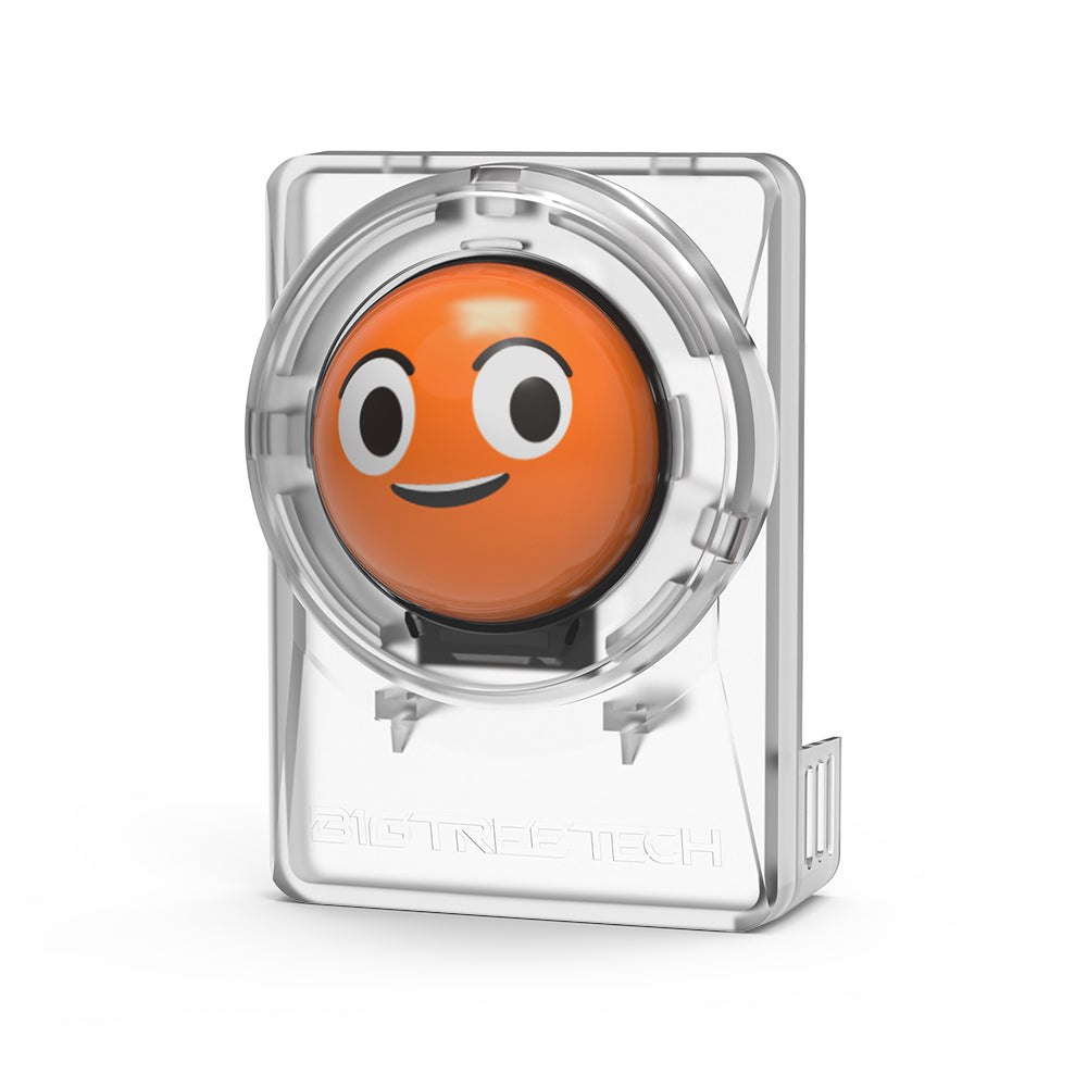 Orange button with a face design in a clear casing on a white background