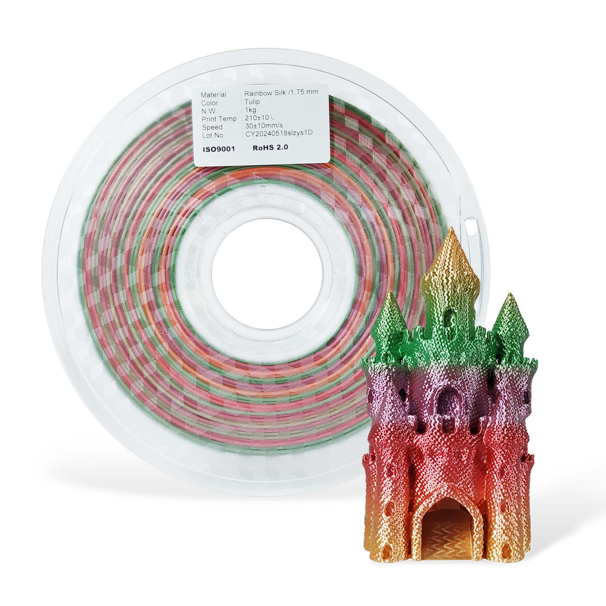 Spool of colorful filament and a 3D printed castle model on a white background