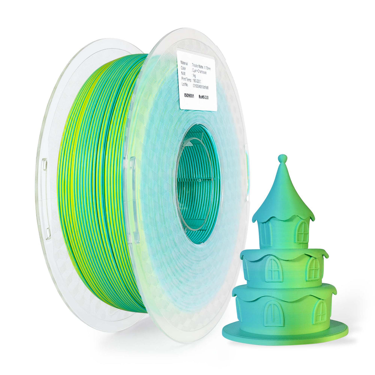 Spool of green and blue 3D printing filament with a small 3D printed house model.