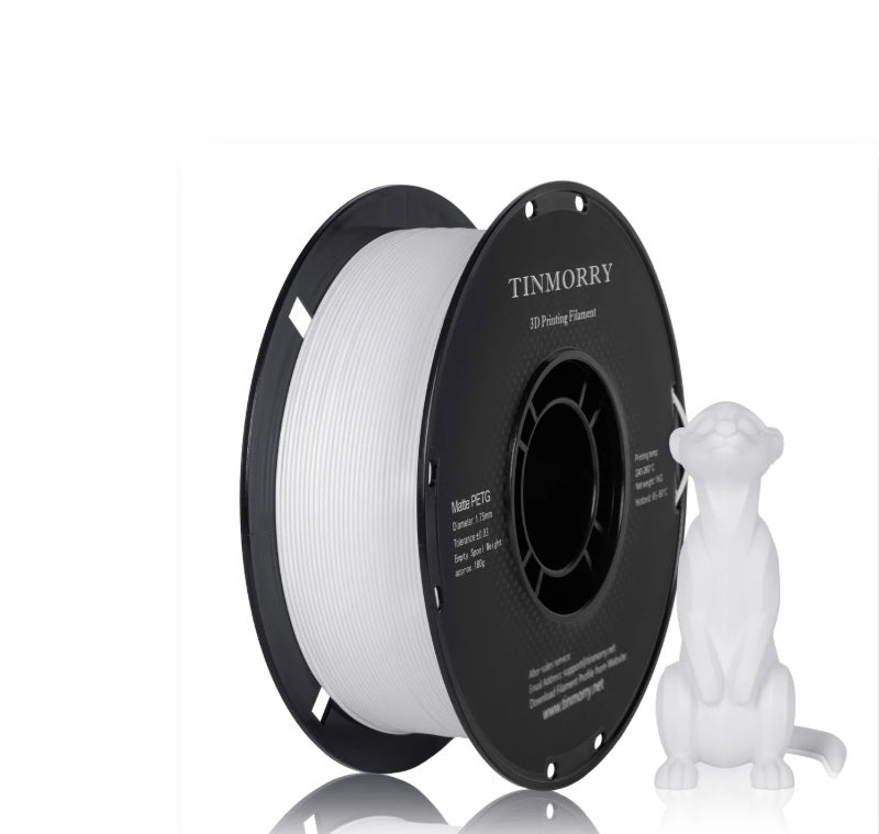 A spool of white 3D printing filament next to a small white printed cat figurine on a clean white background. The spool features a black rim with the brand name TINMORRY printed in white.