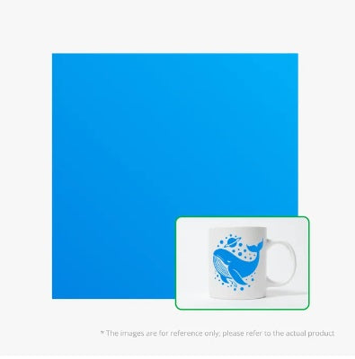 White mug with blue whale design on a white background