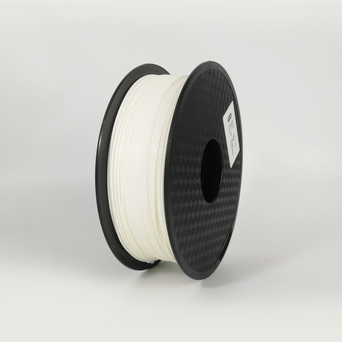 Spool of white filament on a black spool against a light gray background