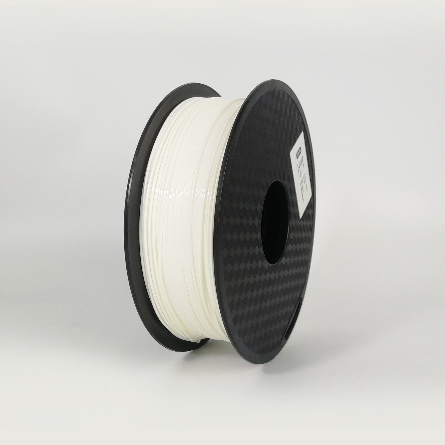 Spool of white filament on a black spool against a light gray background