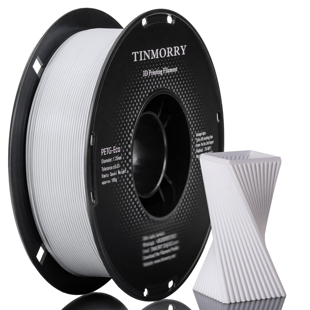 A spool of TINMORRY PETG-Eco 3D printing filament next to a white 3D-printed geometric test print on a clean white background.