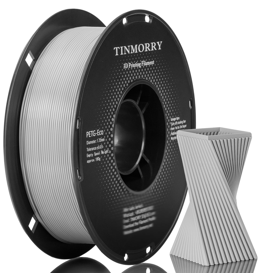A spool of Tinmorry PETG-Eco 3D Printing Filament next to a 3D-printed geometric test structure, shown on a clean white background with a subtle reflection.