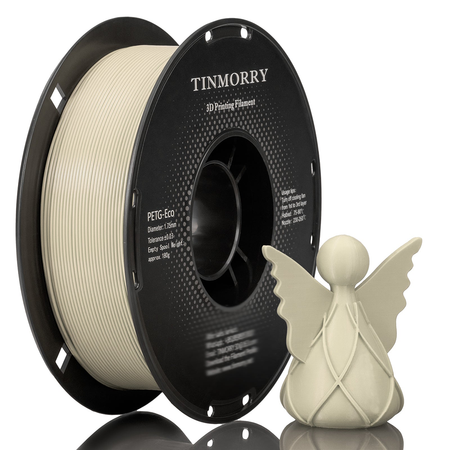 A spool of Meeple White TINMORRY 3D Printing Filament in PETG-Eco, shown next to a small beige angel figurine on a reflective white surface.