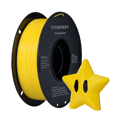 A spool of yellow 3D printing filament with a black label reading TINMORRY, shown next to a small yellow star-shaped object on a plain white background.