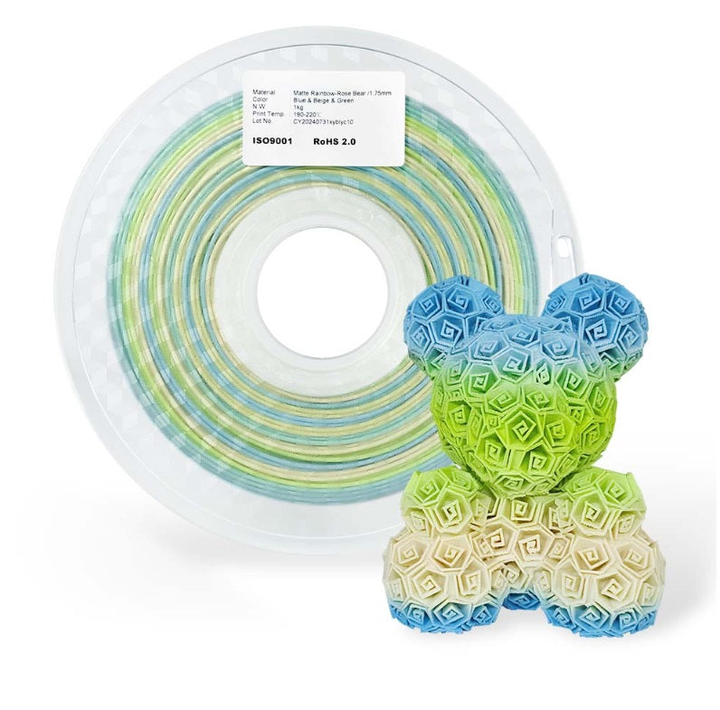 Spool of filament with a colorful honeycomb-shaped object on a white background