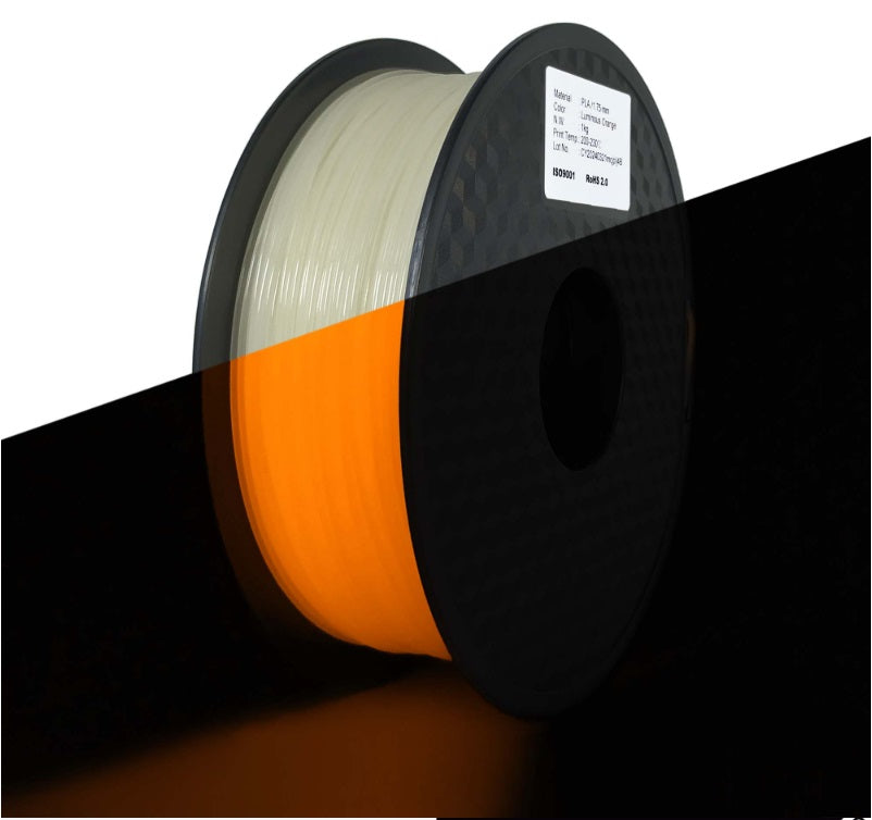Spool of filament with a visible color change from black to orange