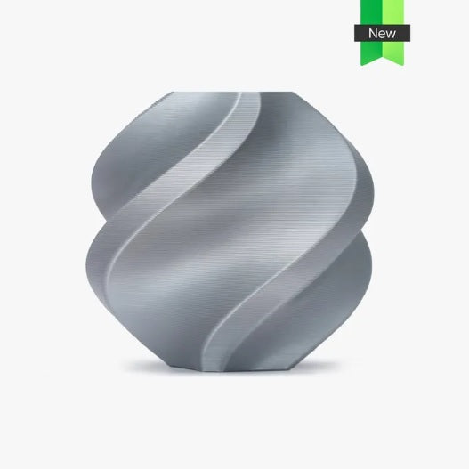 Silver spiral-shaped object with a 'New' label on a light gray background