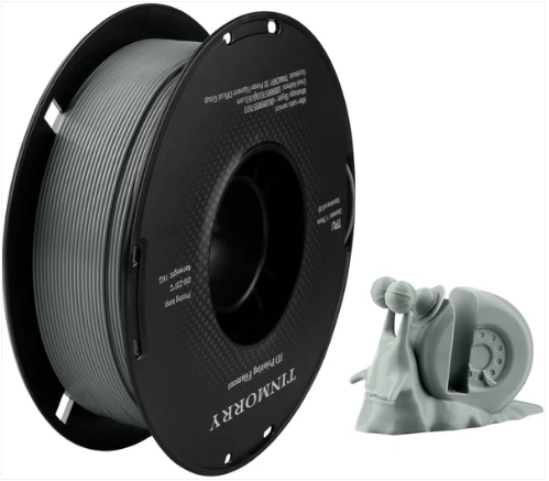 Spool of filament and a 3D printer nozzle on a white background