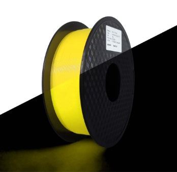 Spool of yellow material on a black background